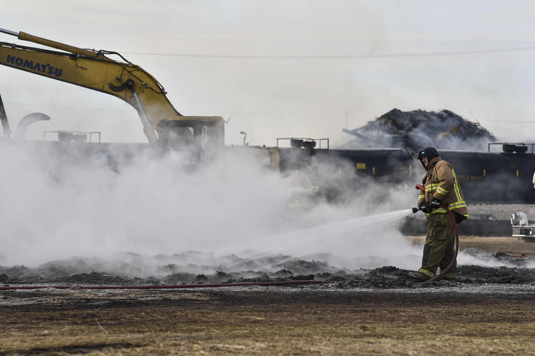 Firefighters continue to extinguish spot fires